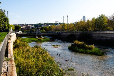 Views of the Madrid Rio park next to the Manzanares river and green vegetation around it