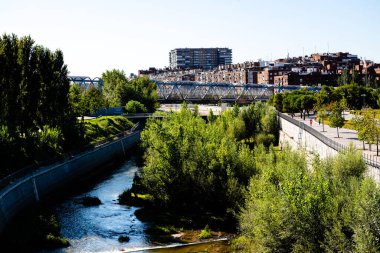 Views of the Madrid Rio park next to the Manzanares river and green vegetation around it