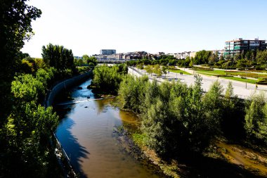 Views of the Madrid Rio park next to the Manzanares river and green vegetation around it