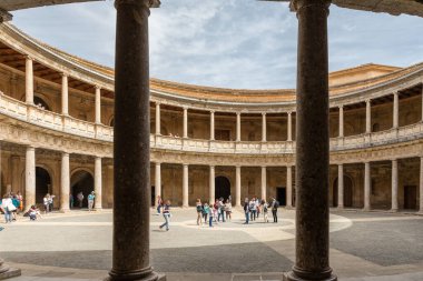 The unique circular patio of the Palace of Charles V with its two levels of columns of Doric and Ionic colonnades, Alhambra, Granada
