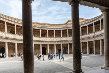 The unique circular patio of the Palace of Charles V with its two levels of columns of Doric and Ionic colonnades, Alhambra, Granada