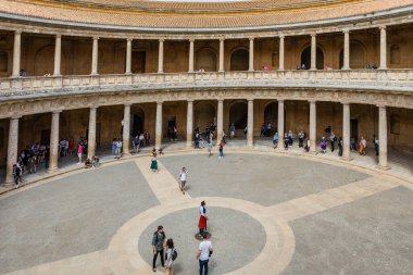 The unique circular patio of the Palace of Charles V with its two levels of columns of Doric and Ionic colonnades, Alhambra, Granada