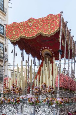 Hooded nazarenos in procession in Granada Andalucia, Spain during Semana Santa, Holy Week