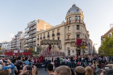 Hooded nazarenos in procession in Granada Andalucia, Spain during Semana Santa, Holy Week