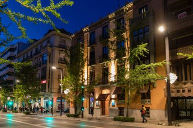 Hooded nazarenos in procession in Granada Andalucia, Spain during Semana Santa, Holy Week