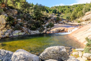 Water torrent called charca verde of the Manzanares river in the Pedriza area of Madrid