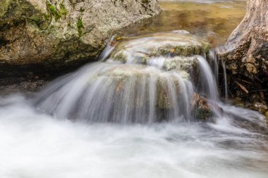 The Purgatory waterfall in the Sierra de Guadarrama. Lozoya Valley Madrid's community. clipart