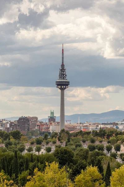 stock image Skyline of Madrid with skyscrapers the four towers and snowy mountains in the background, and in the cemetery of La Almudena in the front