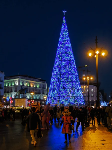 stock image Madrid at Christmas. Night view of the city hall and the famous clock of the door of the sun with Christmas tree in first term.