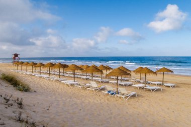 hammocks on the beach of La Barrosa, Cadiz, Spain