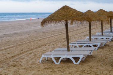 hammocks on the beach of La Barrosa, Cadiz, Spain