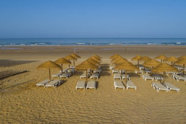 hammocks on the beach of La Barrosa, Cadiz, Spain