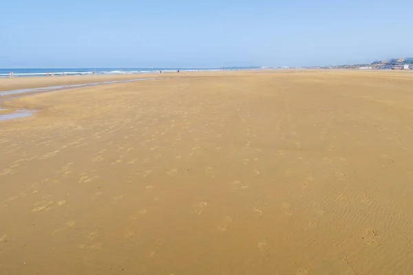 stock image La Barrosa beach, at low tide, in Sancti Petri, Chiclana de la Frontera, Cadiz, Spain