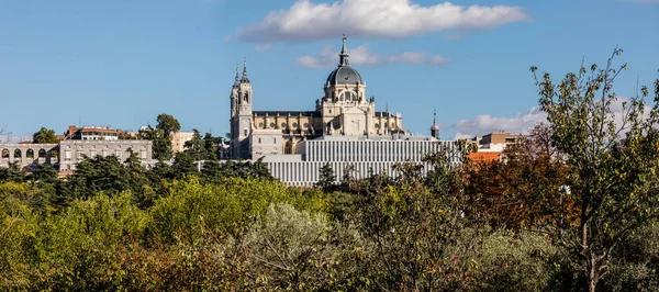 stock image Madrid, Spain skyline at Santa Maria la Real de La Almudena Cathedral and the Royal Palace with park Casa de Campo