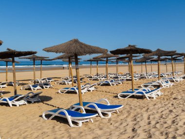 hammocks on the beach of La Barrosa, Cadiz, Spain