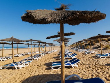 hammocks on the beach of La Barrosa, Cadiz, Spain