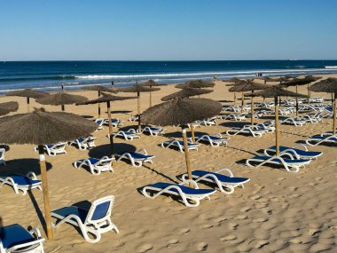 hammocks on the beach of La Barrosa, Cadiz, Spain