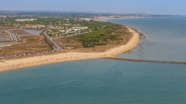 aerial view, from a paraglider, of the Barrosa beach in Sacti Petri, Cadiz, Spain
