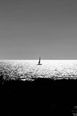 pleasure boats passing in front of La Barrosa beach in Sancti Petri Cadiz