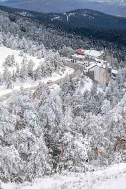 snowy landscapes of Puerto de Navacerrada in the Sierra de Guadarrama in Madrid in the month of March 2024 clipart
