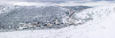 snowy landscapes of Puerto de Navacerrada in the Sierra de Guadarrama in Madrid in the month of March 2024 clipart