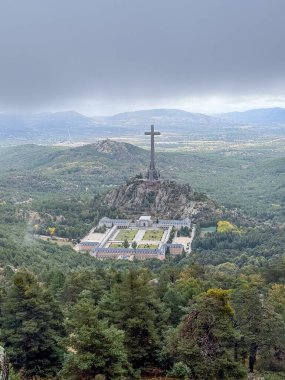 Madrid, Spain - October 17, 2024: Cuelgamuros Valley monumental complex covered by morning fog in Madrid, Spain clipart