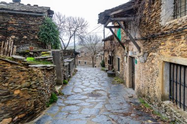 Slate stone antique village of Roblelacasa. Black architecture. Guadalajara, Spain clipart