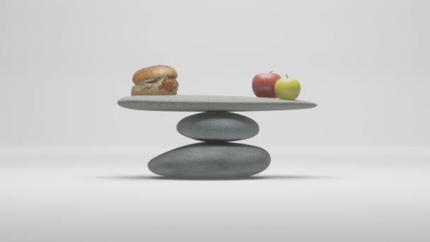 ジャンクフード対健康食品の概念は 完全にバランスの取れた石の上に横たわる2つのリンゴとバランスのとれた高カロリーのハンバーガー 3Dライフスタイルアニメーション — ストック動画