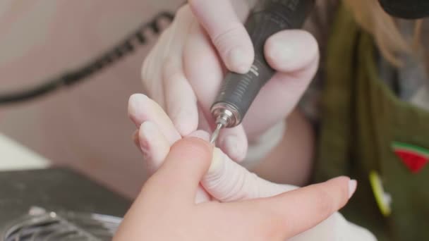 Close Manicurists Hand She Applies Electric Nail Drill Manicure Female — Video Stock