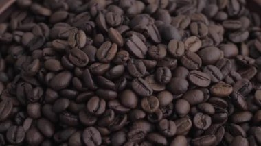 Coffee beans. Dark roast coffee beans top view, rotate. Close up