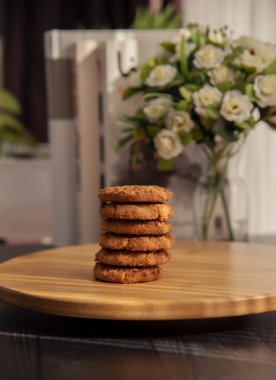 Healty diet fig and oatmeal cookies on a wooden surface