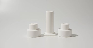 Beyaz seramik mumlar beyaz arka planda durur. iç konsept