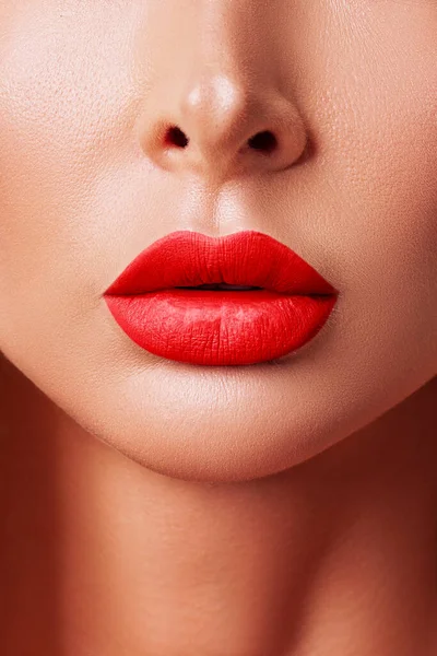 Sexy Red Lips close up. Beautiful Perfect Makeup. Beautiful red Lip Gloss. Cosmetic.Mouth open, big lips.