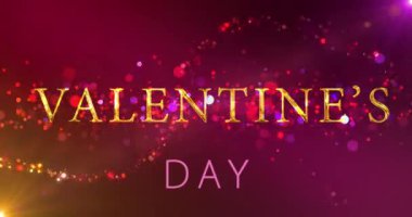 Romantik, şehvetli çiftler Sevgililer Günü 'nü altın yazılar ve peri tozu 4K ile kutluyor. Parlayan toz perili sevgililer günü yazısını ortaya çıkardı. Sevgililer Günün kutlu olsun, 14 Şubat. Aşk kartı BG.