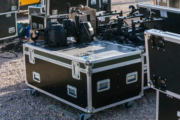 General view of some flight cases during the setting up of the stage of a music festival. High quality photo