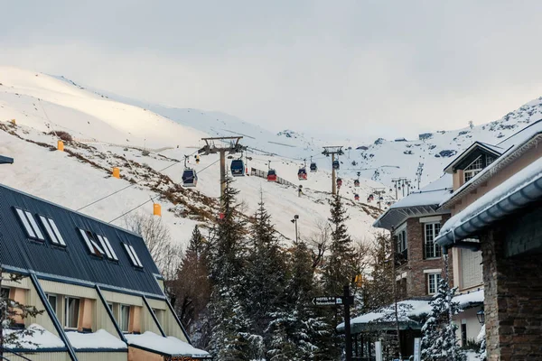 General view of cable cars way to snowy mountain in Sierra Nevada, Granada, Spain. High quality photo