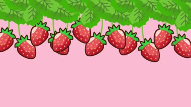 Çilekler yeşil sarmaşıklardan bol bol sarkıyor. Yumuşak pembe arka plana karşı canlı ve taze bir görüntü oluşturuyor..