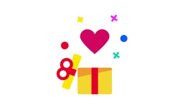 Parıltılarla çevrili bir kalp ve hediye kutusu, neşeli ve sevgi dolu bir atmosferde duygusal neşe ve ödüllendirici sürprizleri temsil eder.