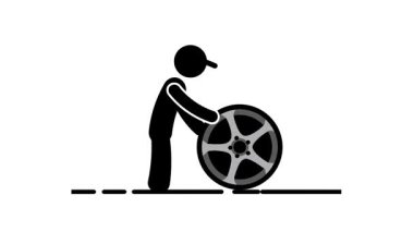 Bir insan güçlü bir lastik çevirme egzersizi yapar, dışarıda fonksiyonel fitness eğitimi yoluyla ham güç ve dayanıklılık gösterir.