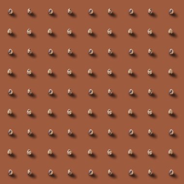 Quail eggs with shadows pattern on brown backgraund