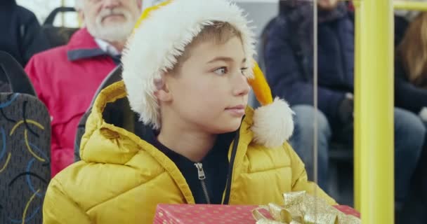 Small Kid Holding Gift Box Knees Bus Boy Wearing Yellow — Stock videók
