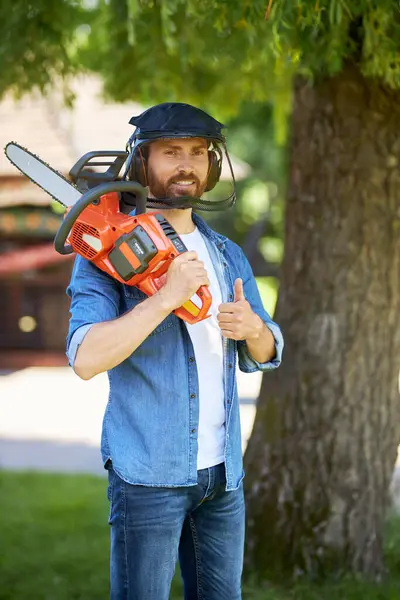 Smiling Male Handyman Safety Shield Showing Thumb While Carrying Cordless — Stock Photo, Image