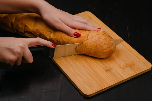 Female Hands Cutting Bread Cutting Board Wood Background — Stock Photo, Image