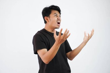 Portrait of angry pensive crazy Asian young man screaming. Closeup man panicking isolated on white background. Stress burnout office syndrome overload work hard office male