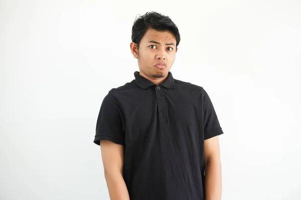 Young Asian Man Wearing Black Polo Shirt White Studio Suspicious — Stock Photo, Image