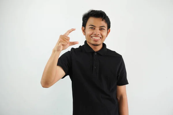 Junger Asiatischer Mann Posiert Vor Weißem Hintergrund Und Hält Etwas — Stockfoto