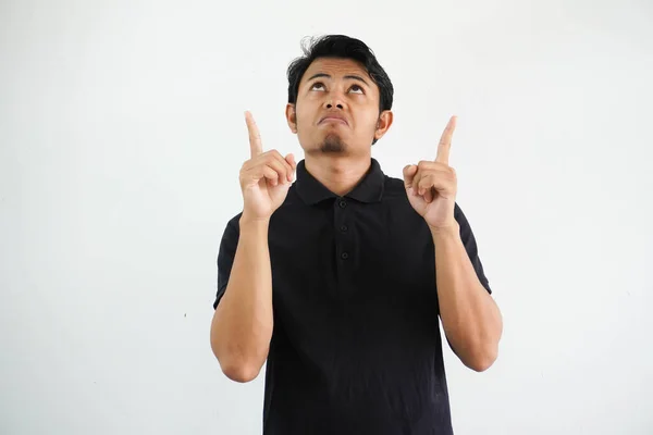 Young Asian Man Confused Pointing Both Hands Wearing Black Polo — Stock Photo, Image