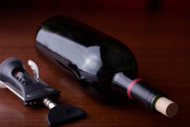 Closeup of a wine bottle on a wood background