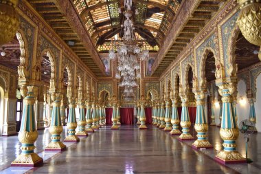 A Beautiful view of the Interiors of Mysore Palace in Karnataka, India with beautiful colorful Pillars
