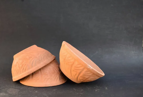 A closeup view of Set of eco friendly Sustainable Earthen Pots or Bowls to serve food or Snacks